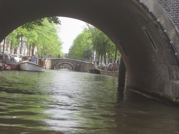 A view of an Amsterdam canal from the water.