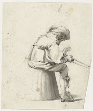 Soldaat zittend op een omgekeerde mand