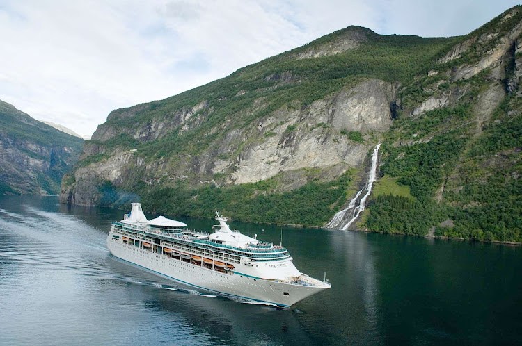Vision of the Seas cruising through a fjord in Norway. The ship now sails to the Mediterranean and Caribbean.