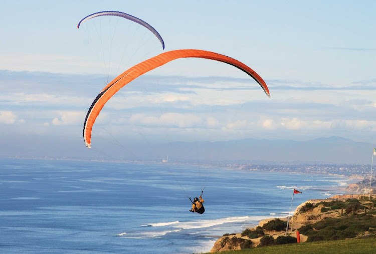 Parakiting over Torrey Pines near San Diego, California.