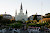 Horse-drawn carriages pull up to Jackson Square in New Orleans. 