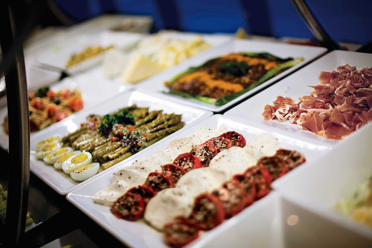 The tempting salad bar at the Brazilian specialty restaurant Moderno Churascaria aboard your Norwegian Cruise Line sailing.