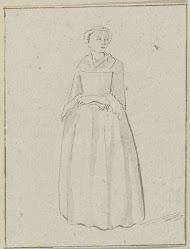 Staande vrouw met over elkaar geslagen armen