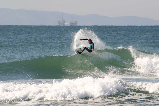 Surfing at Huntington Beach, California.