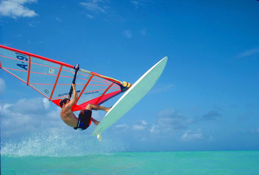 An experienced windsurfer catches some air on Aruba.