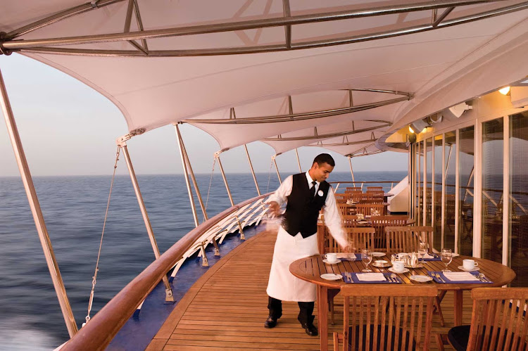 Enjoy a quiet meal and spectacular views on the deck of your Silversea cruise.  