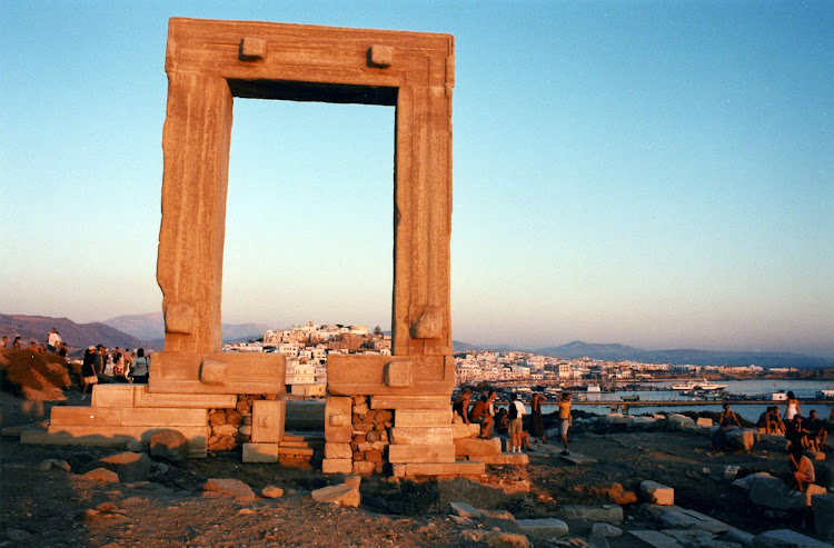 Children play at sunset on the Temple of Apollo on the island of Naxos, where hundreds of visitors gather at sundown every night. The huge marble portal was begun in 522 B.C. on the orders of the tyrant Lygdamis but never completed.