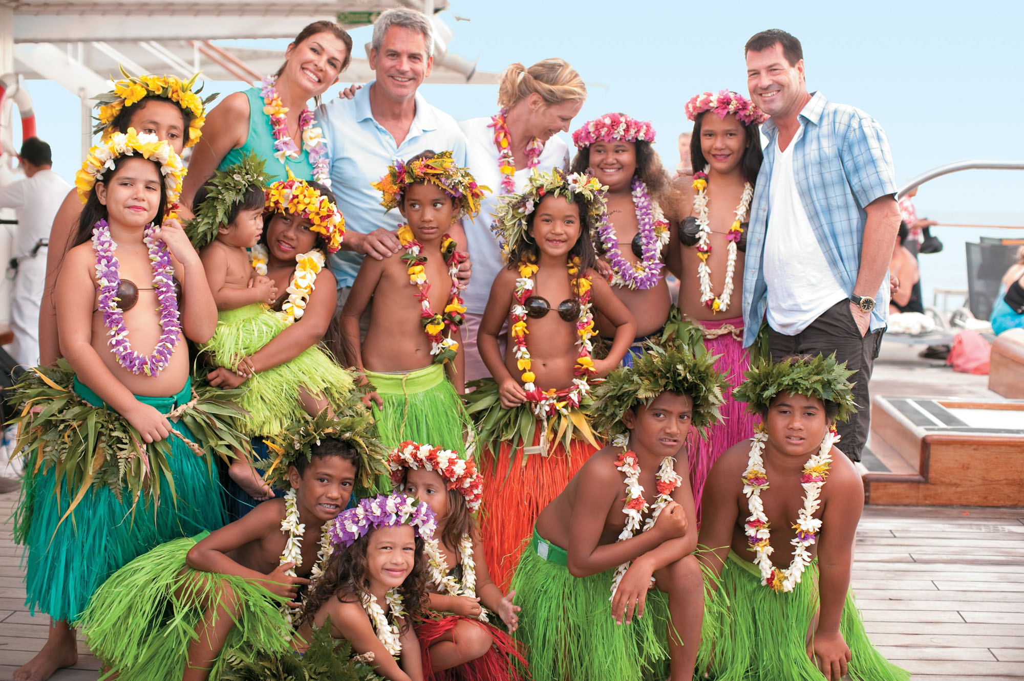 Enjoy authentic entertainment from across the generations while relaxing on the pool deck aboard the Paul Gauguin.