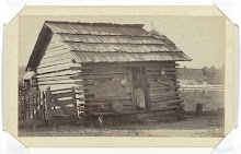 Woman Standing in the Doorway of her Wooden Cabin in or near Thomasville, Georgia, United States