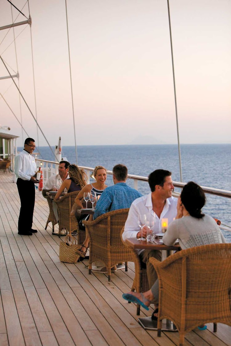 Dine al fresco on deck and take in the passing scenery while dining at Candles Grill aboard your Windstar cruise.
