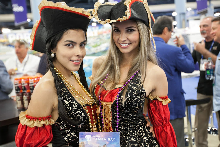 Two of the Tampa Bay Buccaneers our team met at Cruise Shipping Miami in March 2014. We liked the people there, but didn't like having to ship home two 50-pound boxes of very analog brochures.