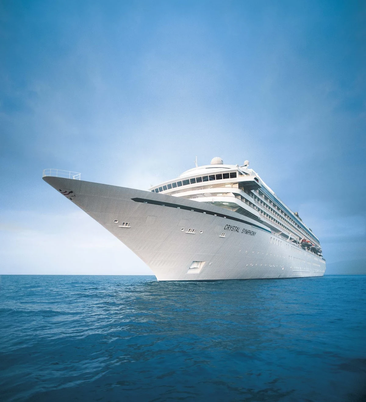 Crystal-Symphony-At-Sea - The Crystal Symphony sails out of the sunrise in crisp arctic waters.