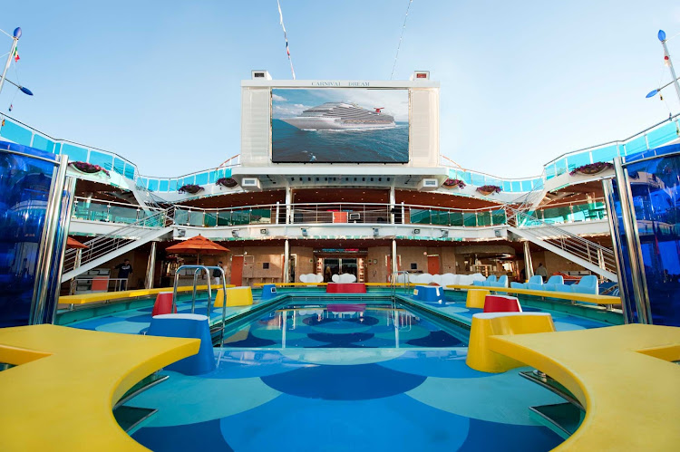 Watch films, concerts and sporting events on the giant LED screen overlooking the Waves pool on Carnival Dream.