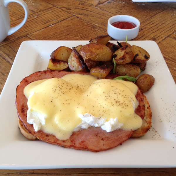 Eggs Benedict with in-house roasted Honey Mustard Ham on GF Toast and Roasted Breakfast Potatoes