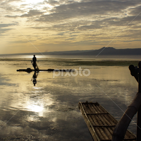 Fisherman on his bamboo raft by Cesar Cambay - Landscapes Waterscapes