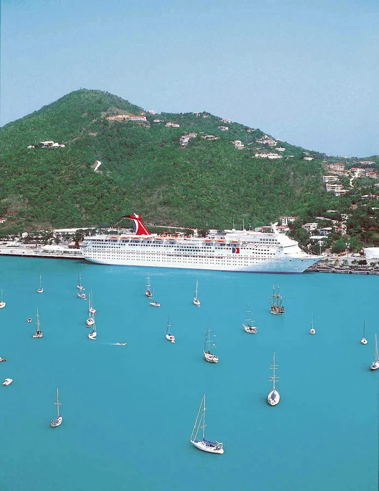 Carnival Ecstasy in port in the warm waters of the Bahamas.