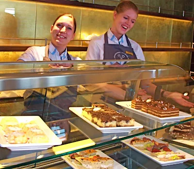 Europa 2 crew members prepare to serve up baked pastries that are perfect for tea or coffee.