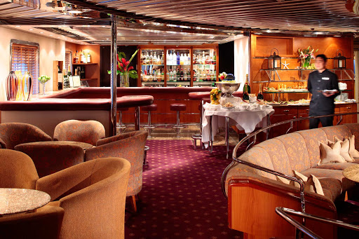 A look at the cocktail area of the main salon, where the captain mingles with guests during a SeaDream voyage.