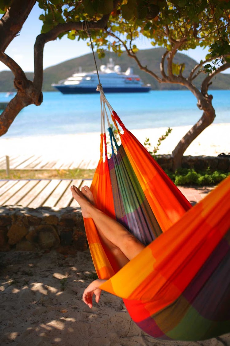 Want to relax? Sling yourself into a hammock during your SeaDream shore excursion.