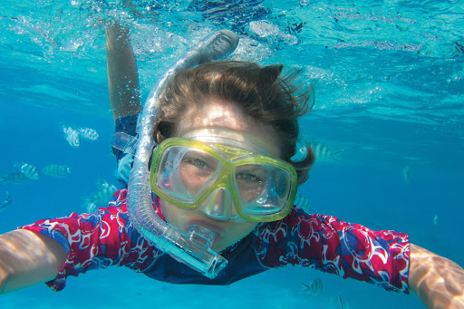 Bora_Bora_snorkel_kid_Paul_Gauguin_2 - Get up close with nature while snorkeing on a Paul Gauguin cruise.