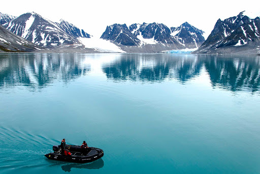 Arctic-Spitsbergen-Magdalena-Fjord-Mountain-Glacier-Zodiac - The majestic Magdalena Mountain Glacier in Spitsbergen in the Svalbard archipelago of Norway on G Adventures' ship Expedition.