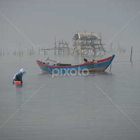 blue in the mist by Igor Fabjan - Landscapes Waterscapes ( blue, vietnam, fog and boat, boat, mist )
