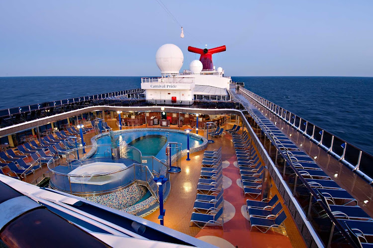 Enjoy the sea breeze and summer sun by the Apollo Pool aboard Carnival Pride.