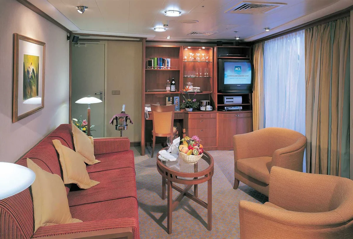 Norwegian-Sky-stateroom-Penthouse-living-room - Norwegian Sky guests can kick back and relax in the separate living areas of a Penthouse suite.