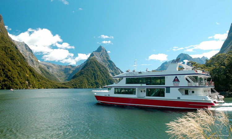 A guided cruise lets you slide between the vertical mountains that form the sides of Milford Sound, New Zealand’s most famous fjord. The sheer rock faces are decorated with ancient mosses, lichen, ferns, native trees and tumbling waterfalls.  