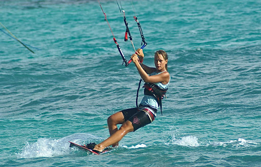 Morph-Kiteboarding-5 - A kiteboarder glides across the surf in Mexico. 