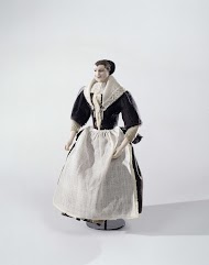 Pop, voorstellende de vroedvrouw of baker