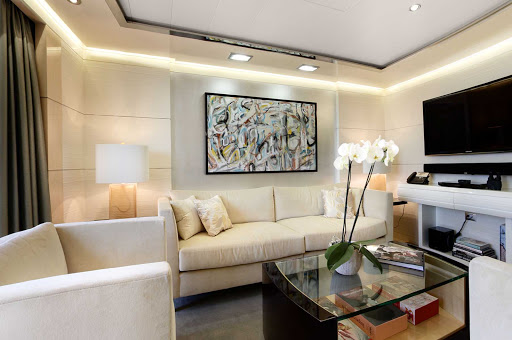 The classically designed Vista Suite lounge area aboard Oceania Marina.
