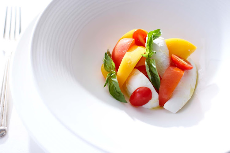 A colorful Caprese is a good way to begin your meal aboard a Crystal cruise.