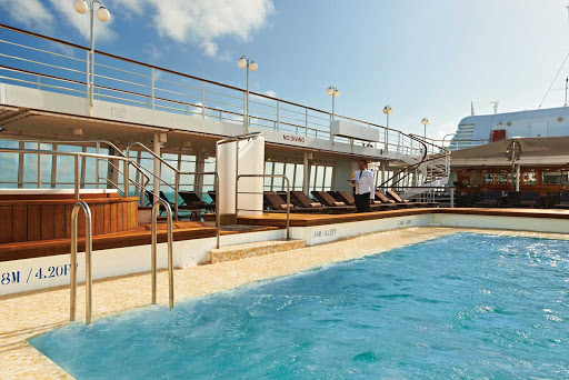 Fun in the sun starts with a comfy chaise lounge and superior drink service at the Pool Bar & Grill aboard Silver Cloud.