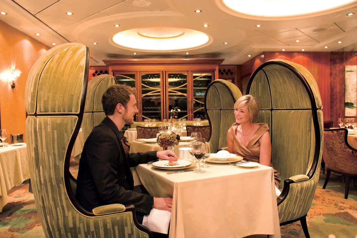 Oasis-of-the-Seas-150-Central-Park-couple - 150 Central Park on Oasis of the Seas offers a six-course tasting menu featuring distinctive  ingredients paired with wines from around the world.