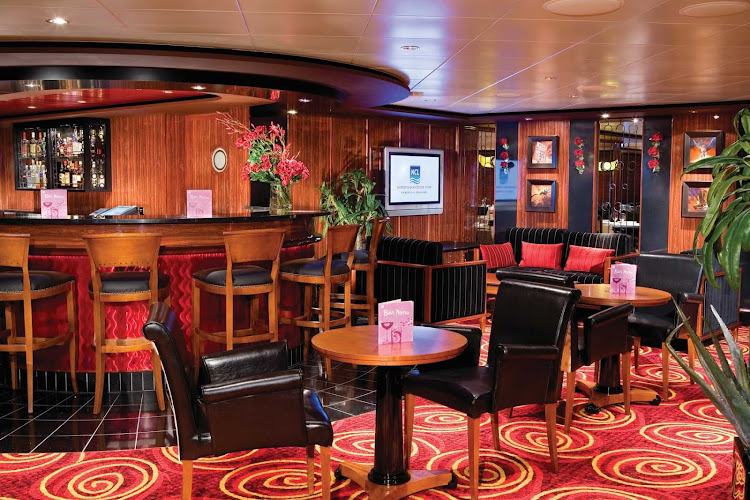 Relax with a cocktail at the Star Bar, located on deck 13 of Norwegian Pearl.