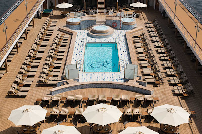 Spend the afternoon bathing in the sun on the spacious pool deck of Seven Seas Mariner.