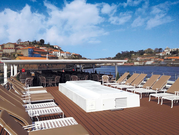 Take in the sights of the Douro River while soaking up the sun on the deck of Uniworld's Queen Isabel.