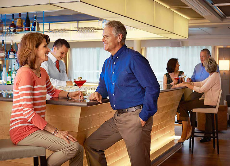 Meet new people and relax with a cocktail in the lounge of your Viking Longship during your European vacation.