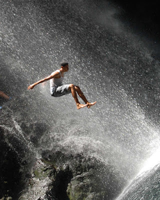 Taking a running jump at the Falls of Baleine on St. Vincent.