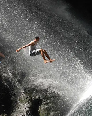 Taking a running jump at the Falls of Baleine on St. Vincent.