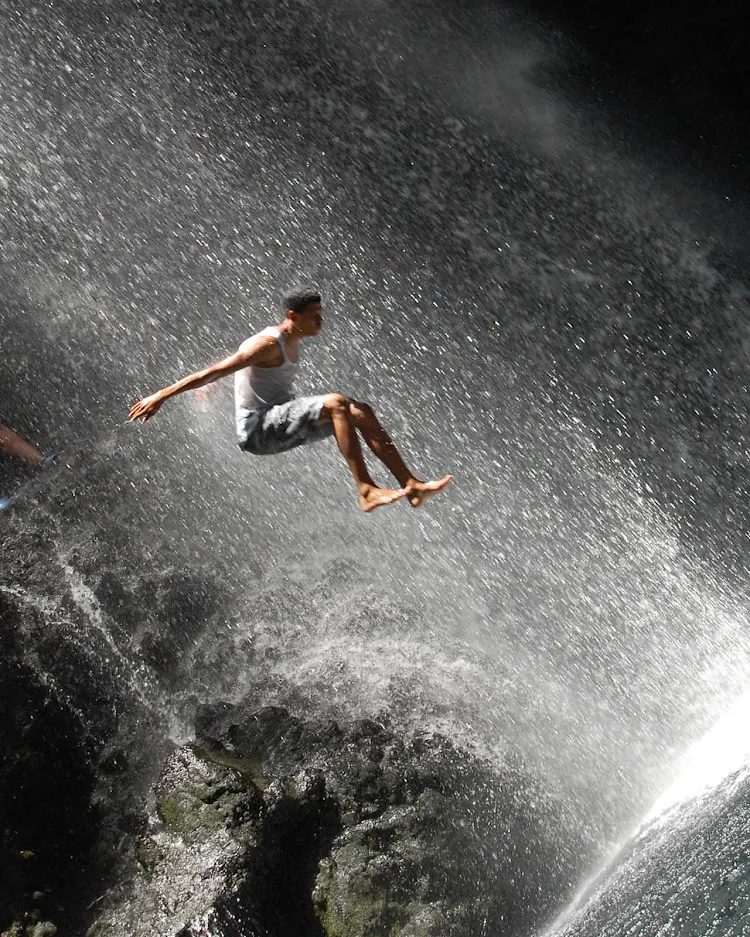 Taking a running jump at the Falls of Baleine on St. Vincent.