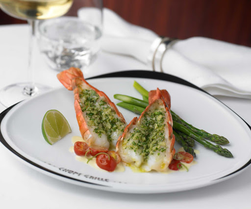 A herb-crusted jumbo shrimp entrée at Chops Grille aboard your Royal Caribbean cruise.
