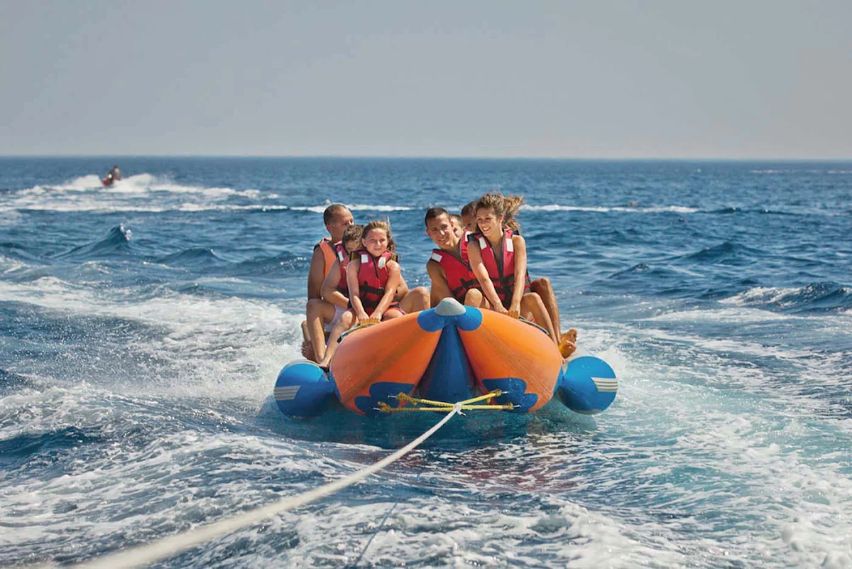 family-raft-eliat-Israel - A family enjoys a tow raft ride in Eliat, Israel.