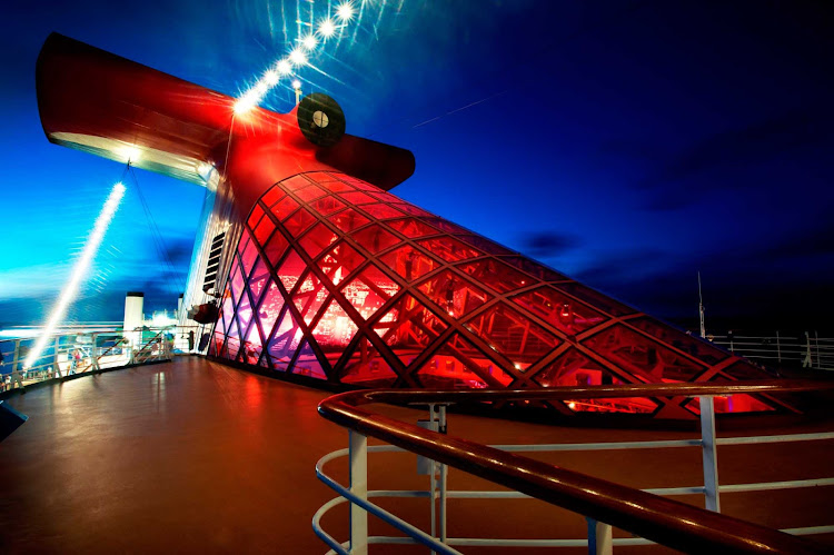 Carnival Miracle's iconic red funnel caps the 11-story Metropolis Atrium below.