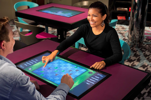 Challenge your partner to a game or two in Celebrity Reflection's Game On room.