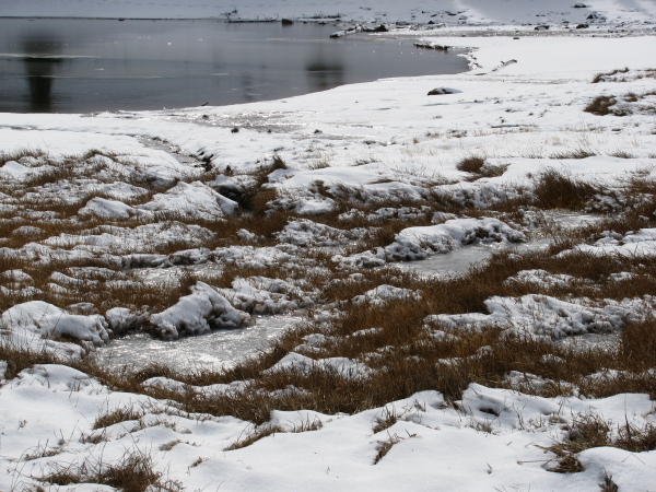 Water still feeding the lakes and leaving trails in the snow.