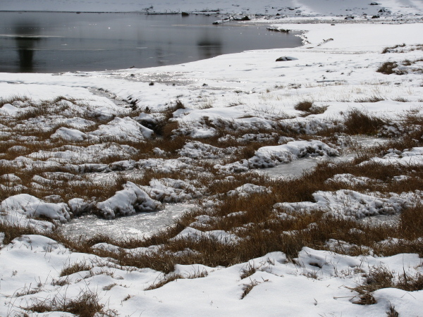 Water still feeding the lakes and leaving trails in the snow.