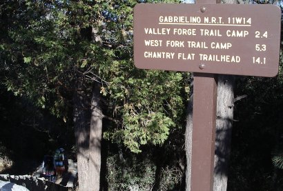 Sign at the trailhead. Sarah and Abbie already started.
