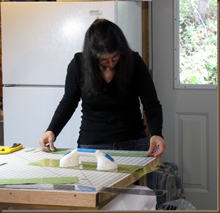 Gina cutting fabric